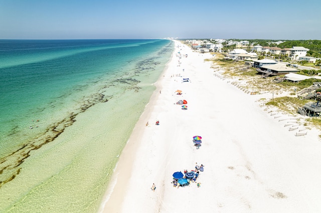 drone / aerial view with a view of the beach and a water view