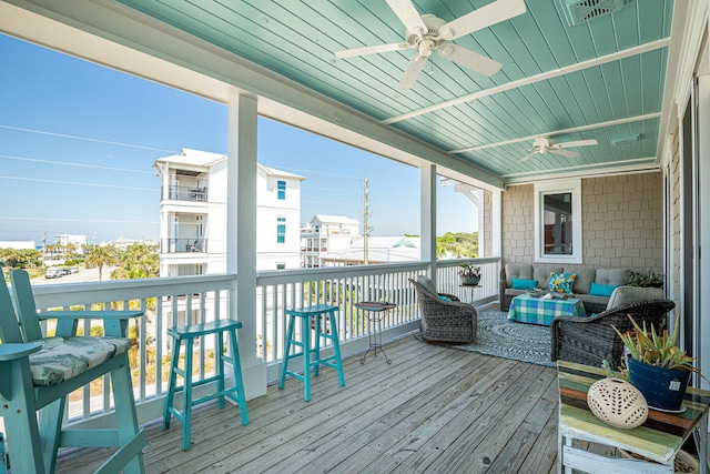 wooden terrace with ceiling fan