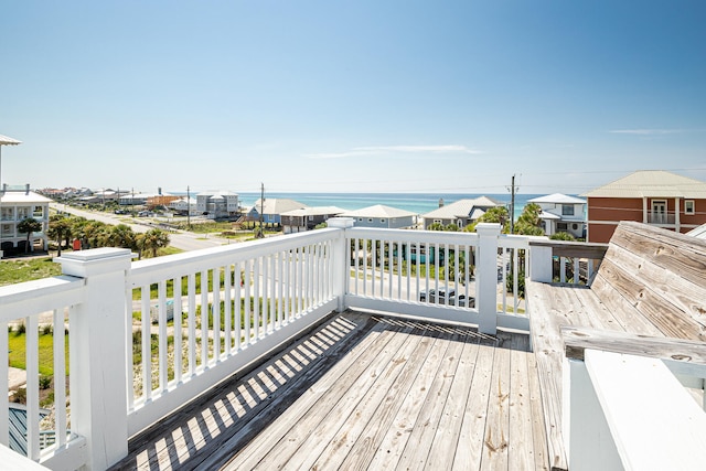 wooden deck featuring a water view