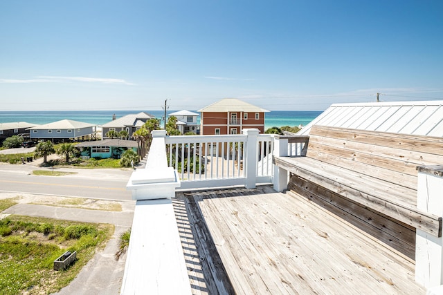 wooden deck with a water view