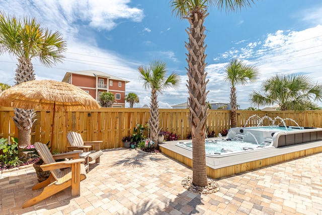 view of patio featuring an outdoor hot tub