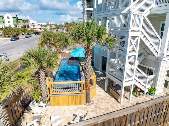 1235 Allen Loop Dr, Santa Rosa Beach, FL 32459 - balcony with stairway and view of pool