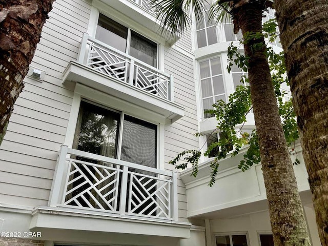 view of home's exterior with a balcony