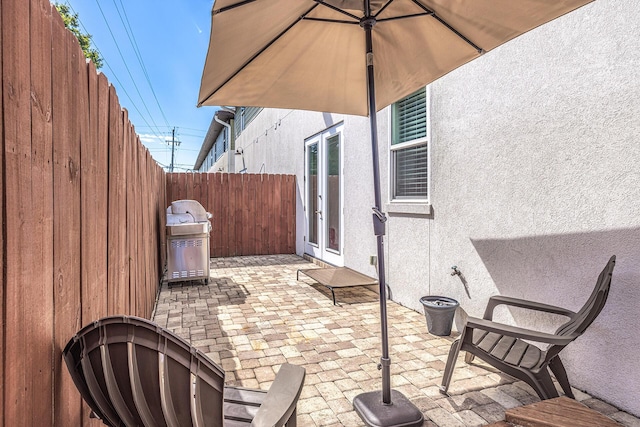 view of patio featuring a fenced backyard and grilling area