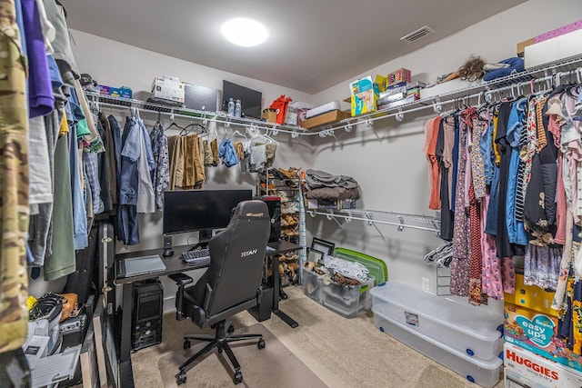 walk in closet featuring carpet flooring and visible vents