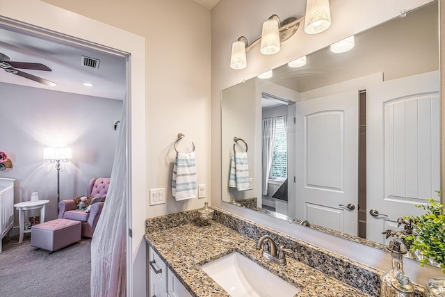 bathroom with ceiling fan, visible vents, and vanity