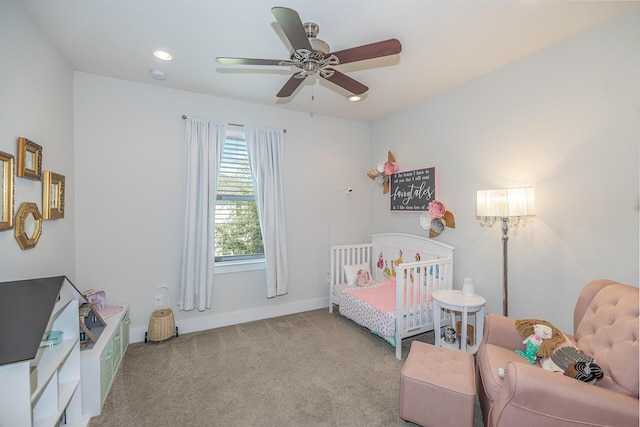 carpeted bedroom featuring a ceiling fan and baseboards