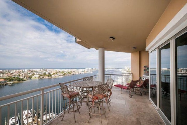 balcony featuring a water view