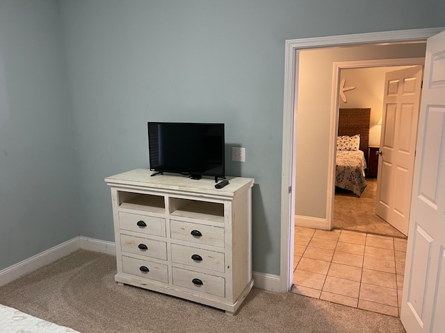 bedroom featuring light tile floors