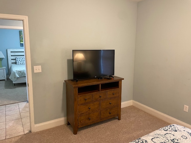 bedroom with light tile floors