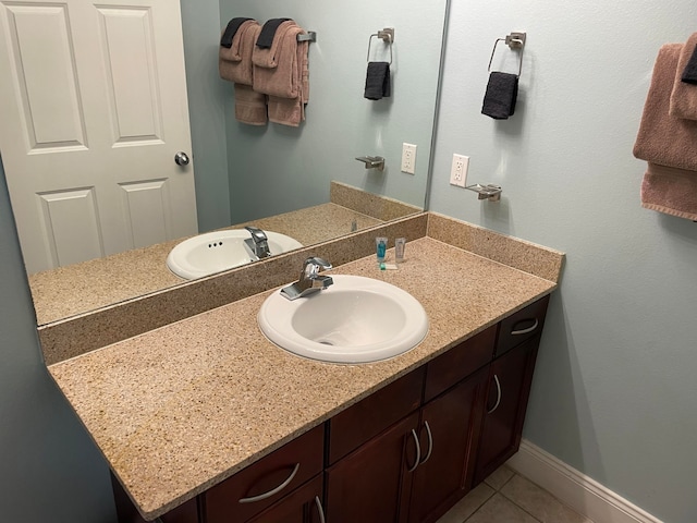 bathroom featuring tile floors and oversized vanity