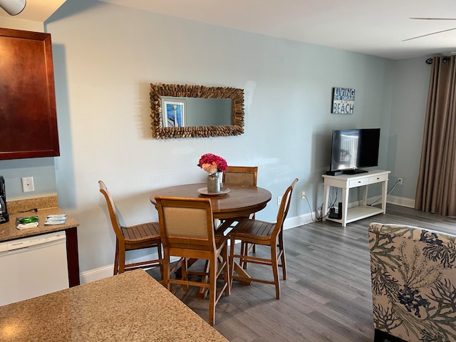 dining area featuring dark hardwood / wood-style floors