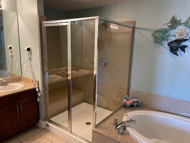 bathroom featuring large vanity, shower with separate bathtub, and tile flooring