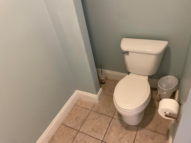 bathroom featuring toilet and tile flooring