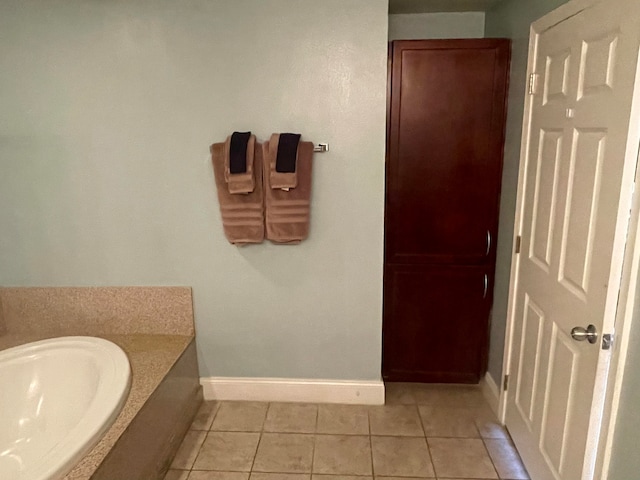 bathroom featuring a bathing tub and tile floors