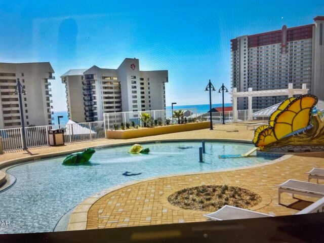 view of swimming pool featuring a patio area