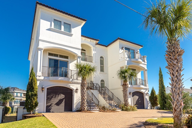 24 Norriego Rd, Destin, FL 32541 - mediterranean / spanish home with a balcony and a garage