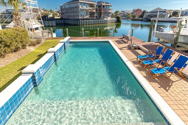 24 Norriego Rd, Destin, FL 32541 - view of swimming pool featuring a boat dock and a water view