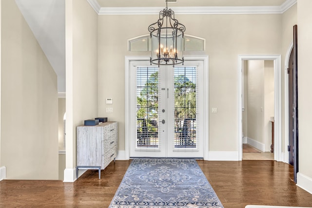 24 Norriego Rd, Destin, FL 32541 - foyer entrance featuring dark hardwood / wood-style floors, french doors, a chandelier, and ornamental molding