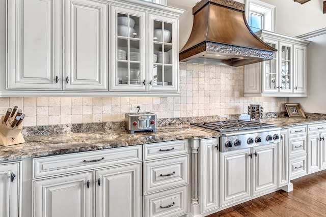 24 Norriego Rd, Destin, FL 32541 - kitchen featuring white cabinets, custom exhaust hood, and dark wood-type flooring