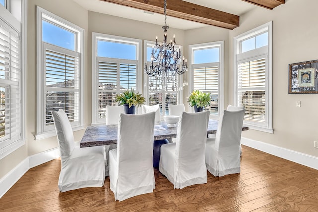 24 Norriego Rd, Destin, FL 32541 - dining area featuring beam ceiling, dark hardwood / wood-style flooring, and an inviting chandelier