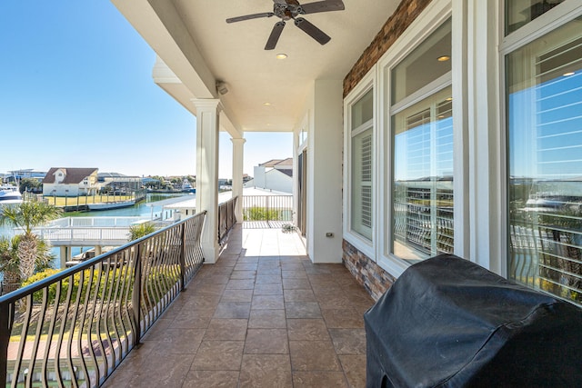 24 Norriego Rd, Destin, FL 32541 - balcony featuring area for grilling, ceiling fan, and a water view