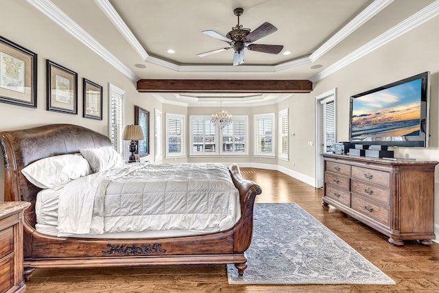 24 Norriego Rd, Destin, FL 32541 - bedroom with ceiling fan with notable chandelier, dark hardwood / wood-style floors, a raised ceiling, and crown molding
