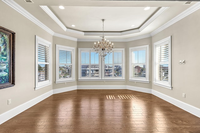 24 Norriego Rd, Destin, FL 32541 - spare room featuring a healthy amount of sunlight, a notable chandelier, dark hardwood / wood-style floors, and a raised ceiling