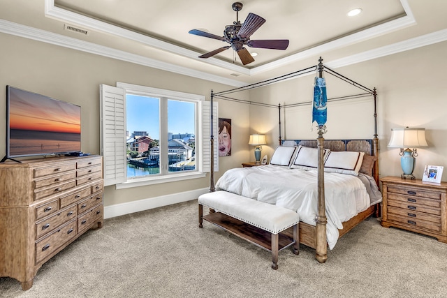 24 Norriego Rd, Destin, FL 32541 - bedroom with crown molding, light carpet, ceiling fan, and a tray ceiling