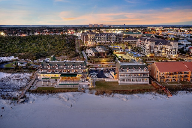 aerial view at dusk with a water view