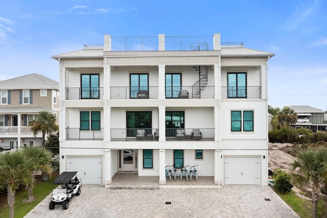 exterior space featuring a balcony and a garage