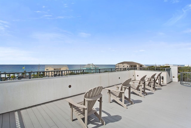 view of terrace with a water view