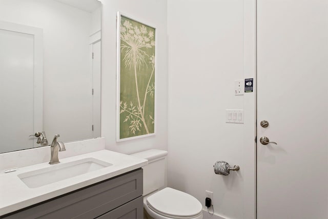 bathroom with oversized vanity and toilet