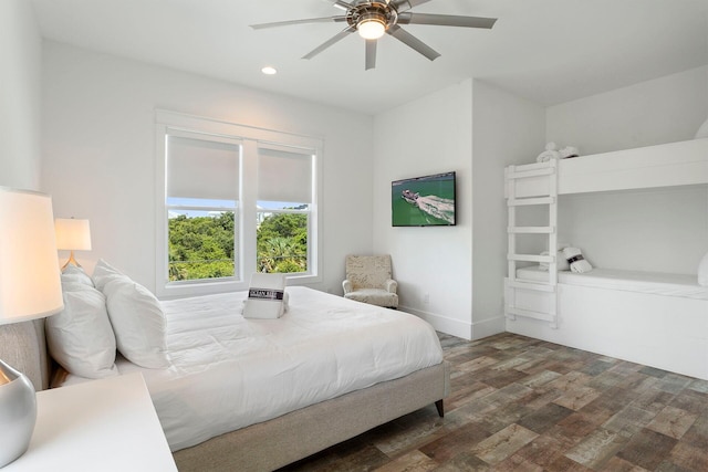 bedroom with ceiling fan and dark wood-type flooring