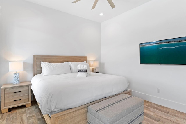 bedroom featuring light hardwood / wood-style floors and ceiling fan