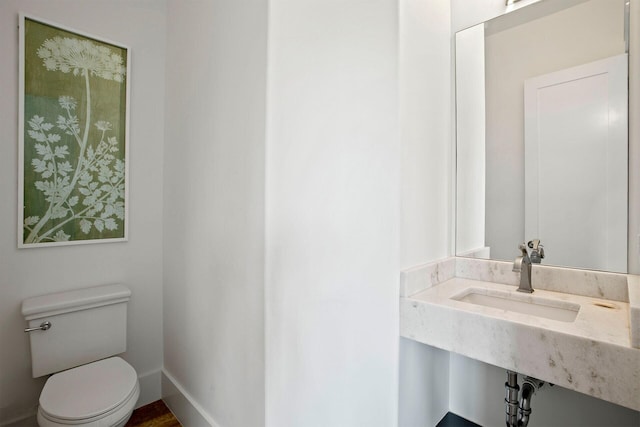 bathroom featuring sink and toilet