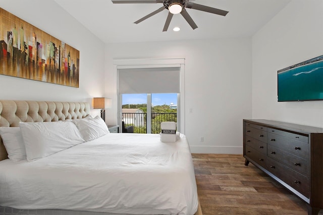 bedroom featuring dark hardwood / wood-style floors, ceiling fan, and access to exterior