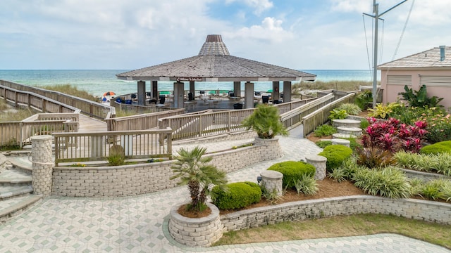 view of property's community featuring a water view and a gazebo