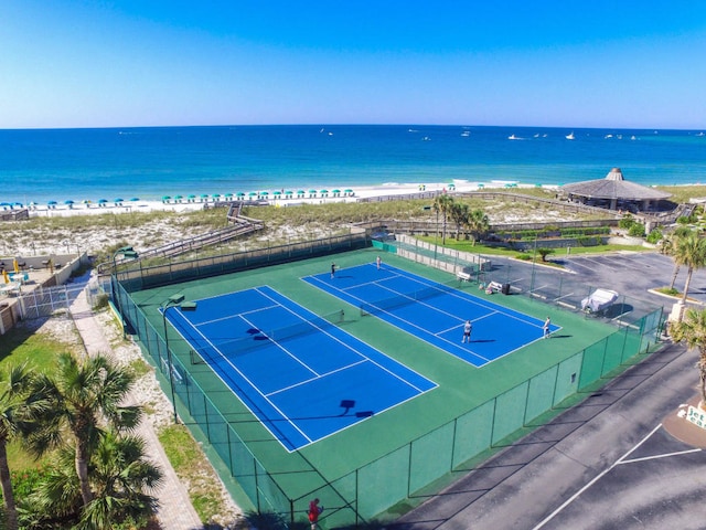 view of sport court featuring a water view