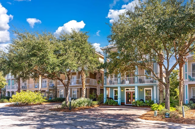 view of front of house featuring a balcony