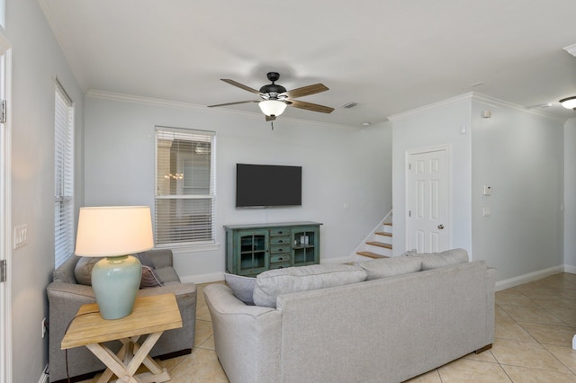 tiled living room with ornamental molding and ceiling fan