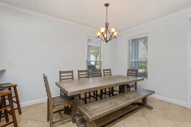 dining area featuring a chandelier, ornamental molding, and light tile floors