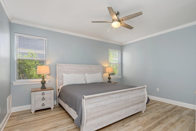 bedroom with ornamental molding, multiple windows, ceiling fan, and light wood-type flooring