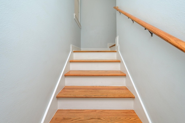 stairway featuring light hardwood / wood-style flooring