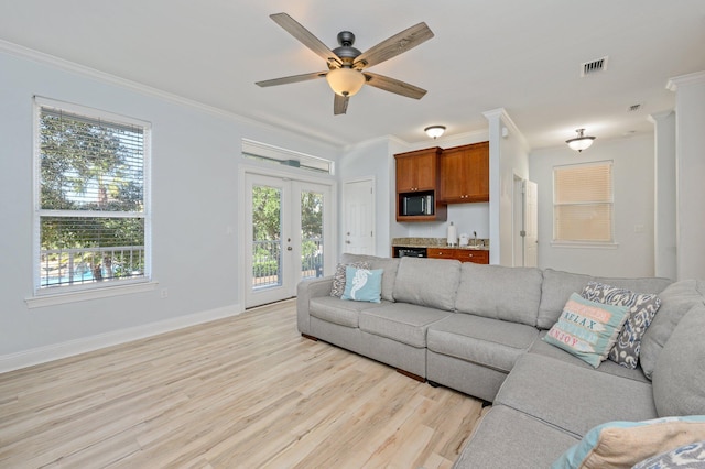 living room with french doors, ceiling fan, light hardwood / wood-style floors, and ornamental molding