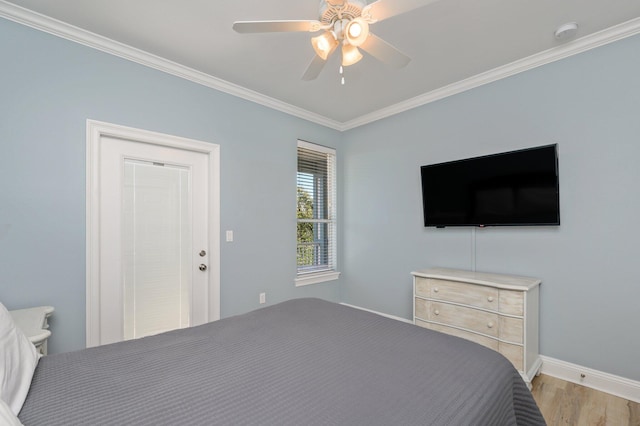 bedroom with ornamental molding, light hardwood / wood-style flooring, and ceiling fan