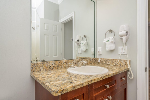 bathroom with oversized vanity and crown molding