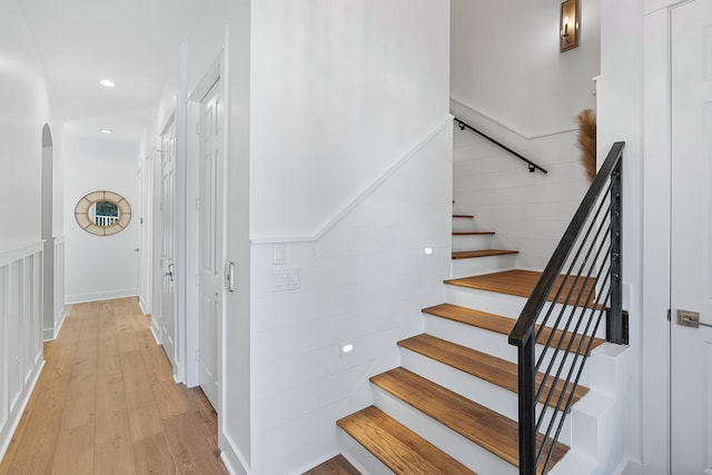 stairway featuring light hardwood / wood-style floors