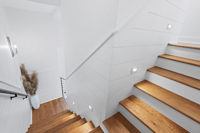 staircase with light hardwood / wood-style flooring