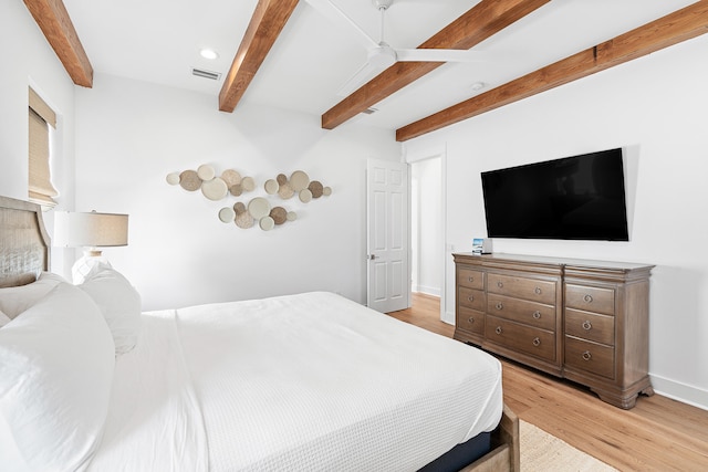 bedroom featuring beam ceiling, ceiling fan, and light hardwood / wood-style floors